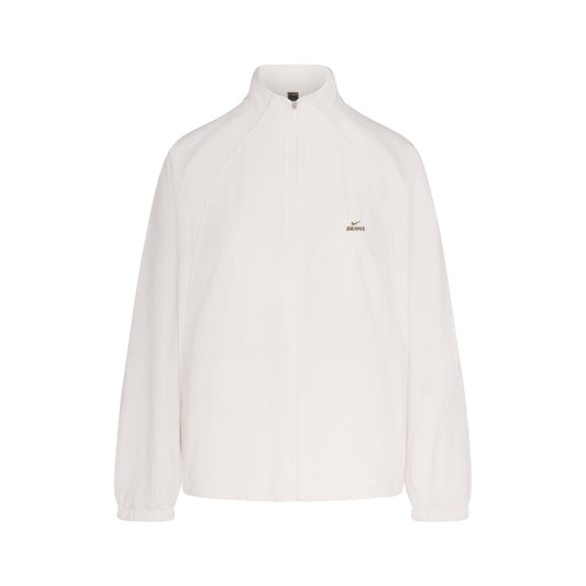 NikeSKIMS STRETCH NYLON OVERSIZED TRACK JACKET | IVORY